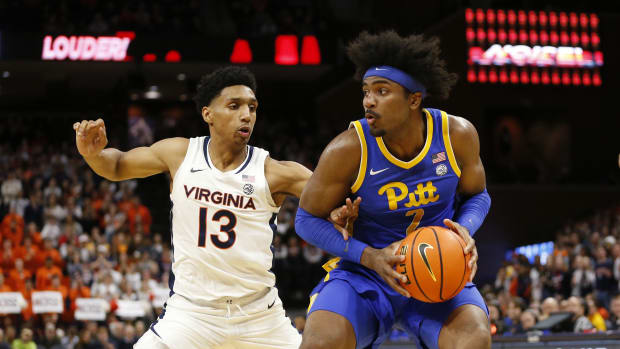 Pittsburgh Panthers forward Blake Hinson (2) controls the ball as Virginia Cavaliers guard Ryan Dunn (13) defends during the first half at John Paul Jones Arena.